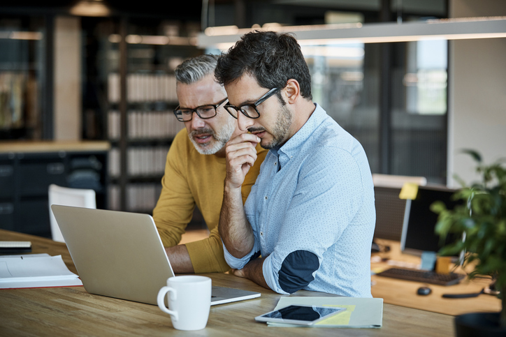 A father and son calculating imputed interest on a family loan.