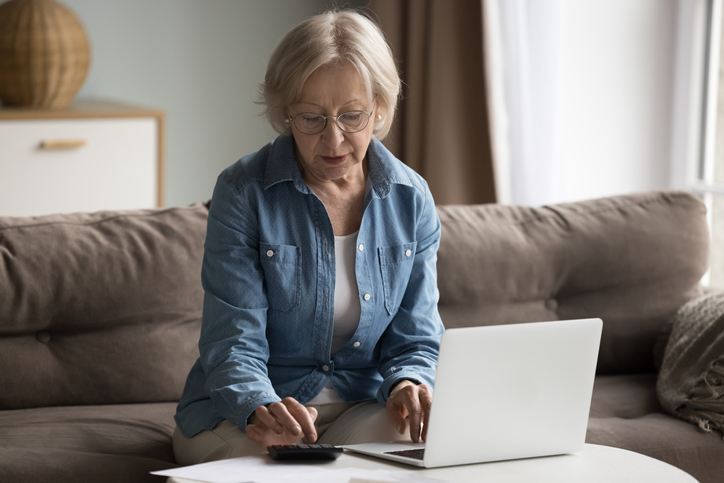 An investor calculating returns on her socially responsible investments.