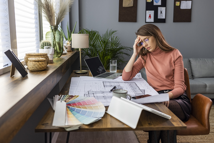 A woman thinking about how much she could invest in a new home after paying capital gains taxes on the sale of her old home.