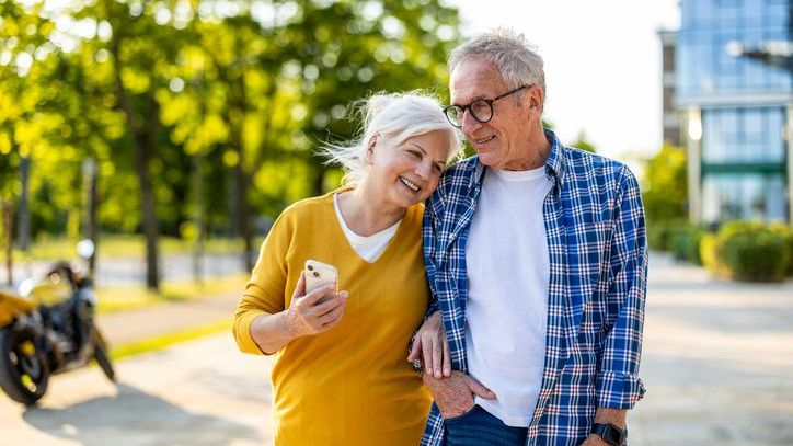 A retired couple who get some of their income from an annuity enjoy an afternoon walk together. 