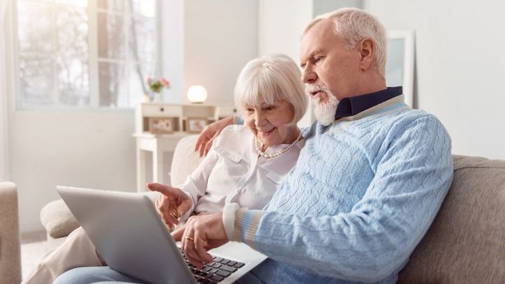 A retired couple reviews their Social Security statements together.