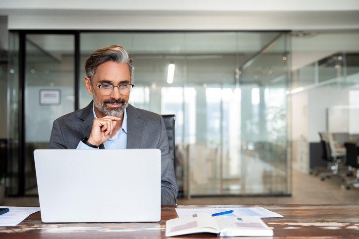 A commercial real estate investor reviewing his portfolio.